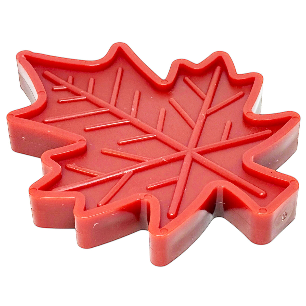 Red SodaPup Canadian Maple Leaf nylon chew toy, angled view showing the textured leaf surface