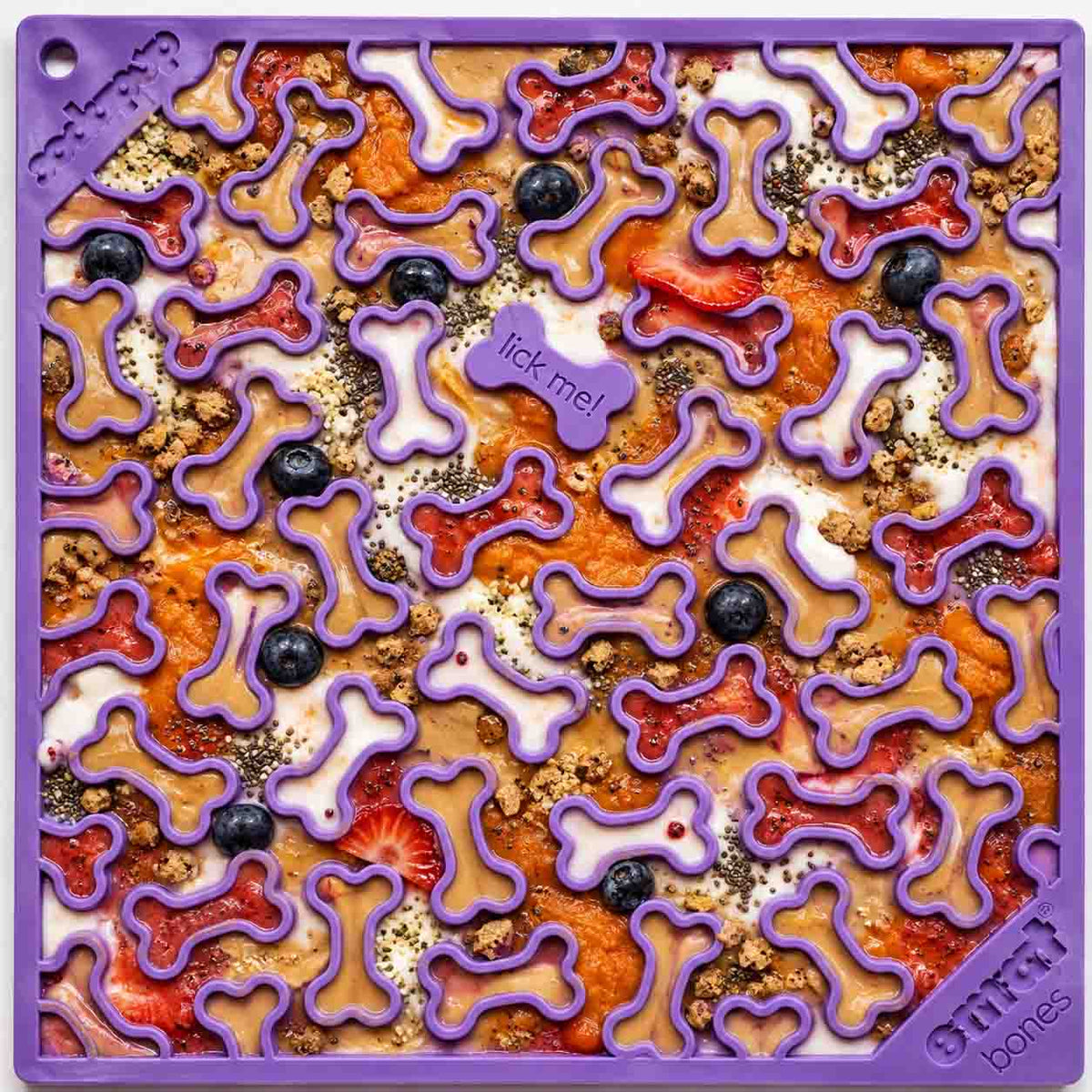 Purple Bones lick mat covered in colourful treats