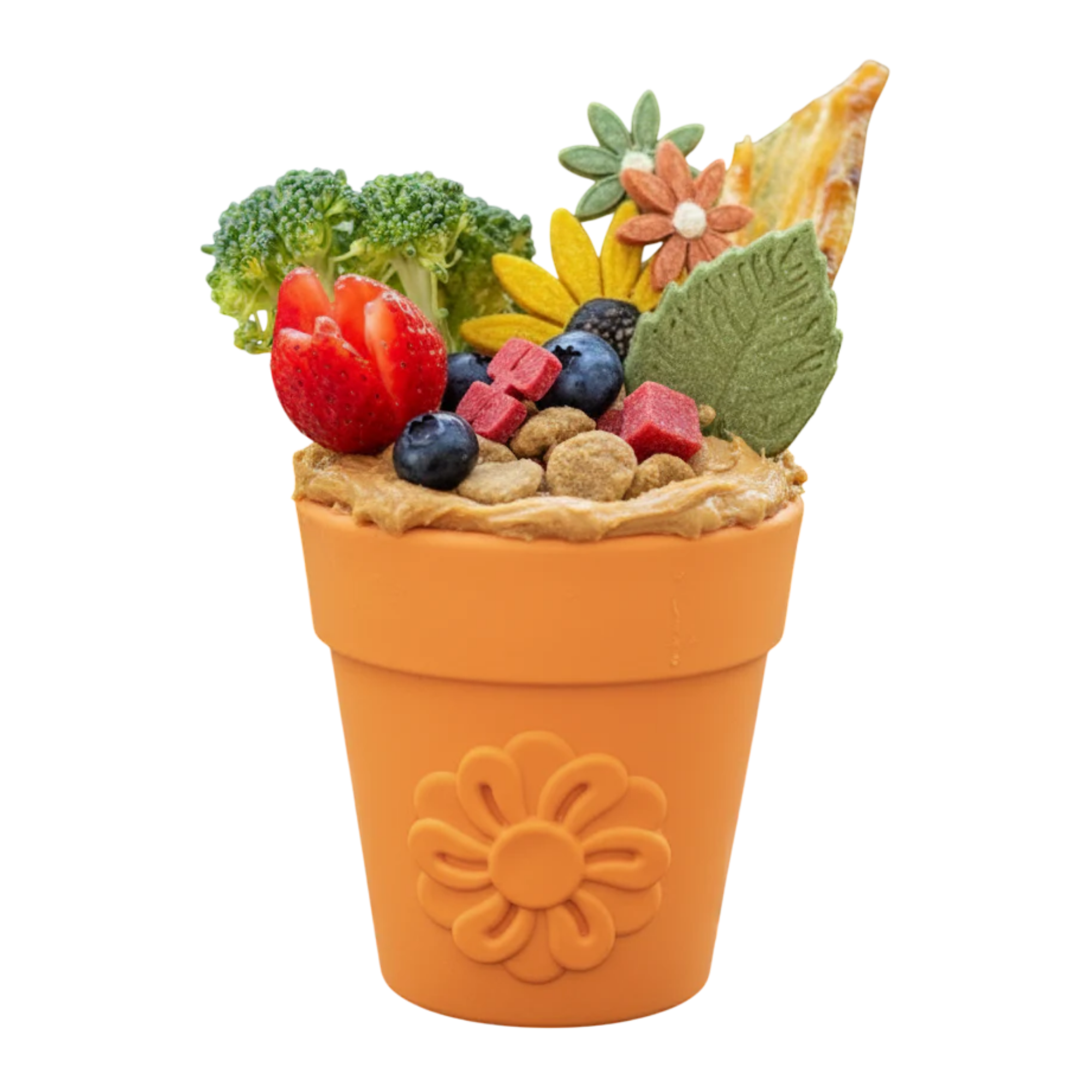 Orange SodaPup Flower Pot treat dispenser stuffed with healthy dog treats including broccoli, strawberries, blueberries, and peanut butter.