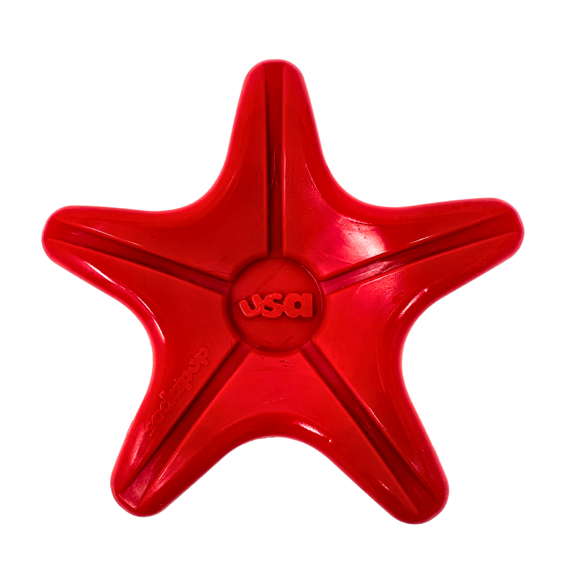 Red star-shaped dog toy with smooth contours and embossed 'USA' at the center