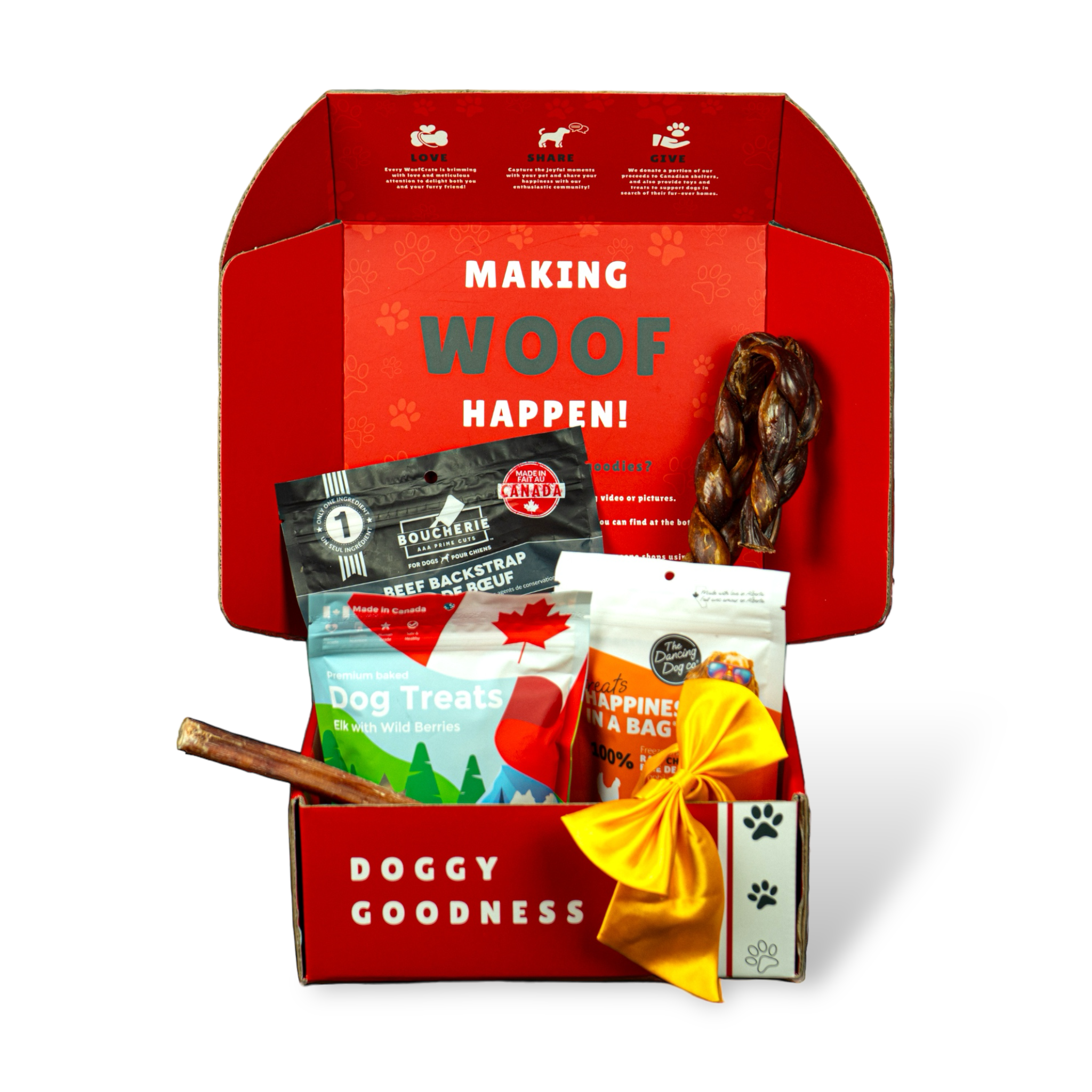 Open red dog box with 3 treat bags, 1 braided chew, 1 stick chew, and yellow ribbon under “Making WOOF Happen!” lid