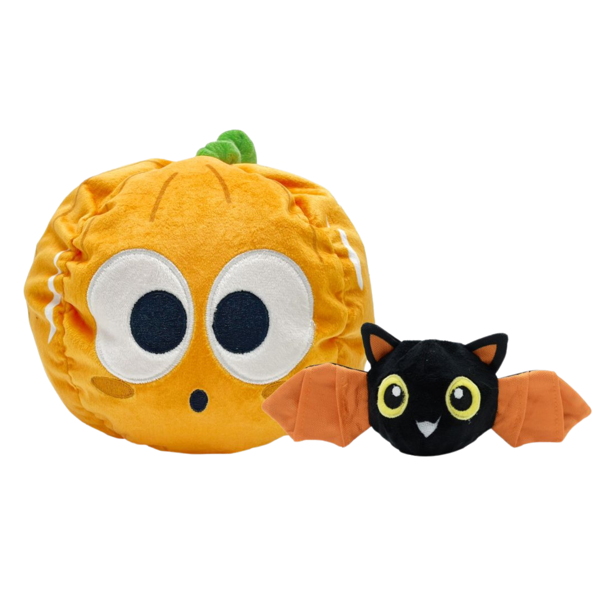 Plush pumpkin toy with wide eyes and a bat toy with orange wings