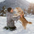 Dog owner playing with his dog in the snow