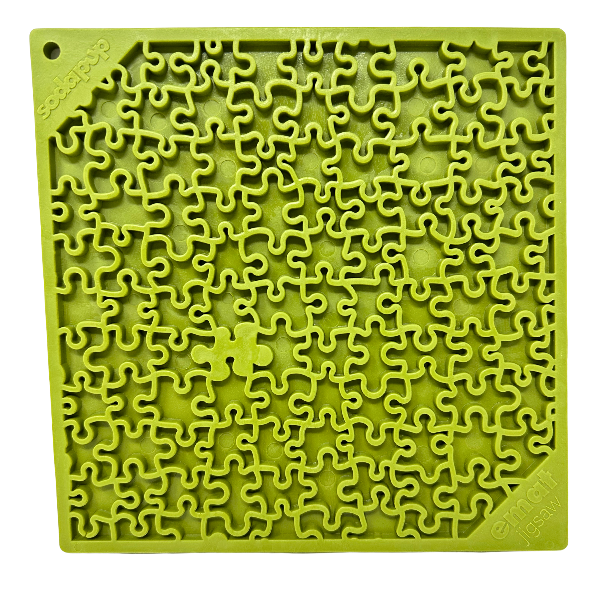 Close-up of a green dog lick mat with a detailed jigsaw puzzle pattern