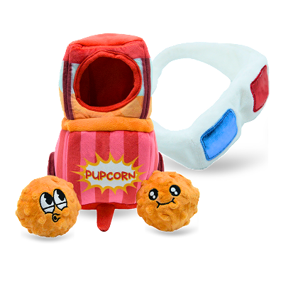 Toy popcorn container with plush popcorn toys and a remote control on a white background