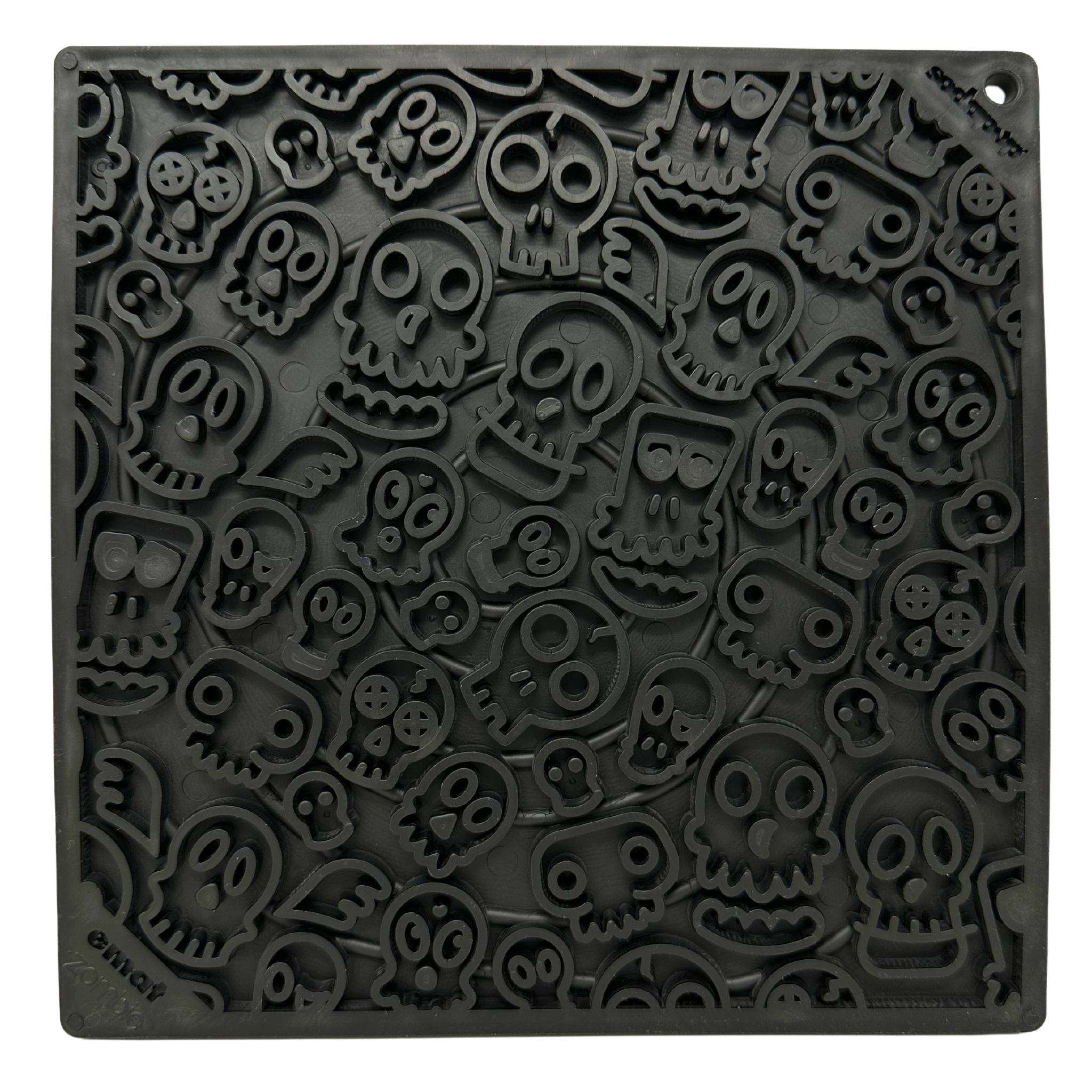 Black lick mat with raised cartoon skull pattern and the word 'zombie' embossed in the corner
