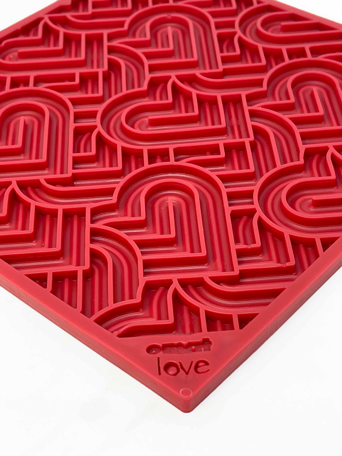 Angled view of the red Hearts lick mat