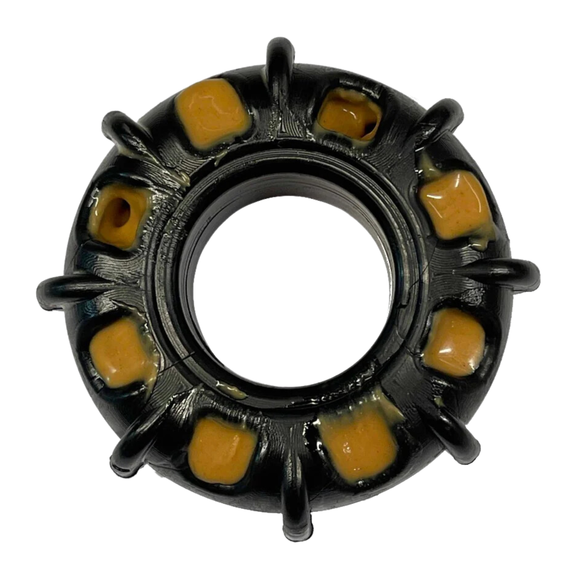 Black rubber dog toy shaped like a tire with yellow treat slots around the edge