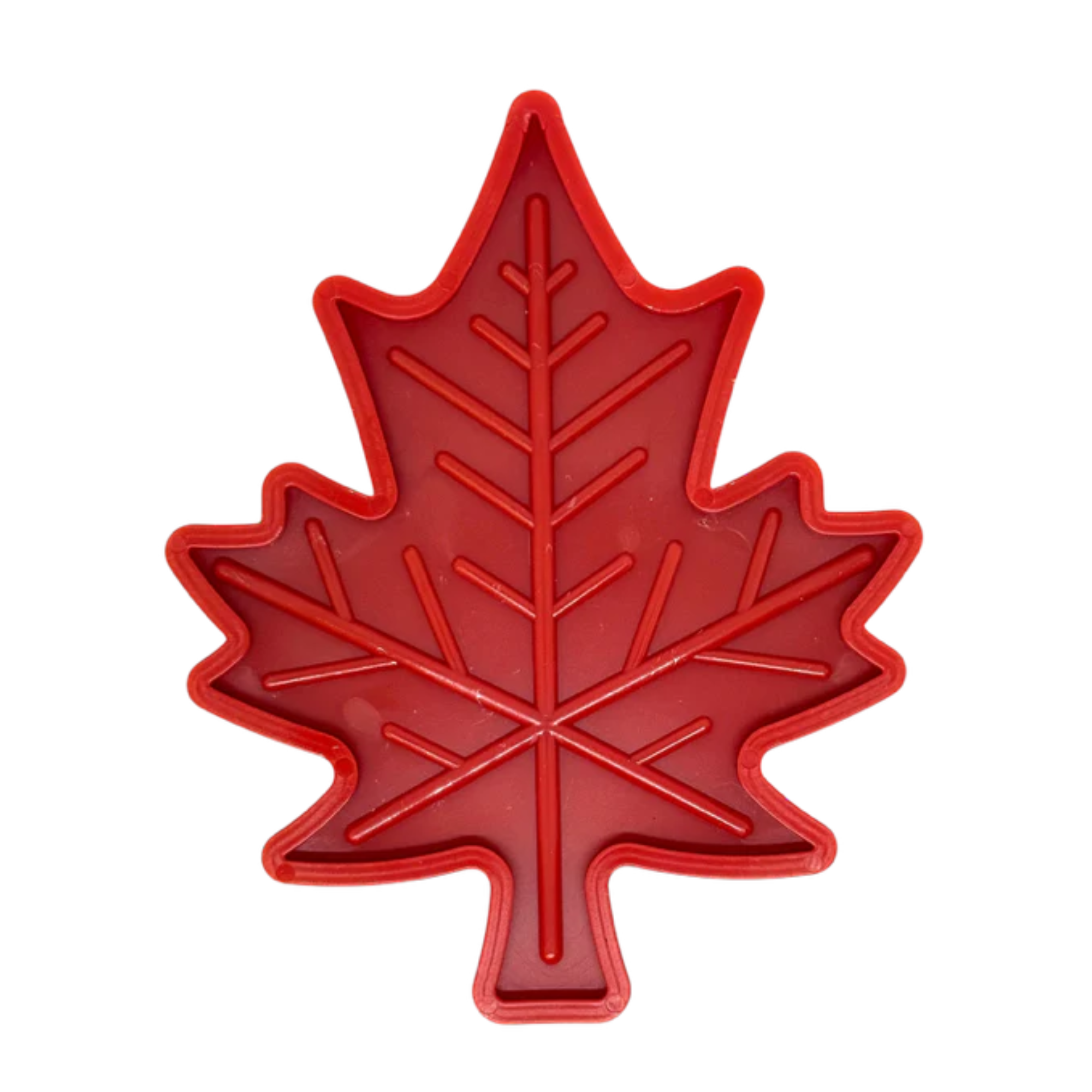 Red dog lick mat shaped like a stylized maple leaf with ridged design