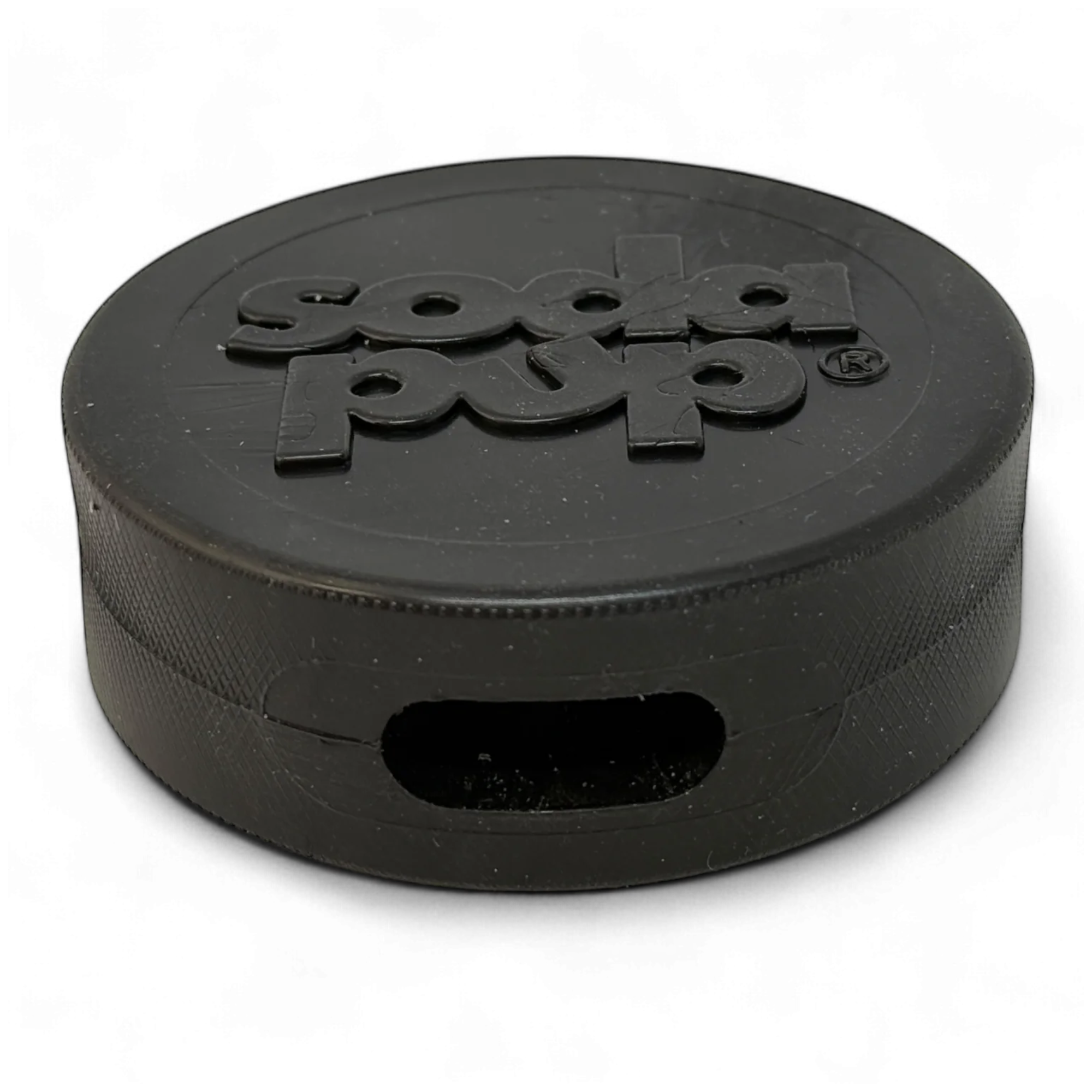 Black dog toy shaped like a hockey puck with "soda pup" embossed on the top