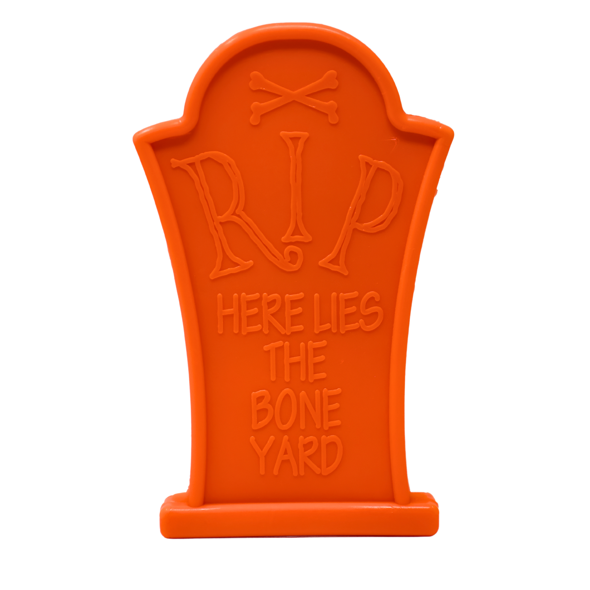 Orange dog chew toy shaped like a tombstone with "RIP Here Lies The Bone Yard" embossed on the front