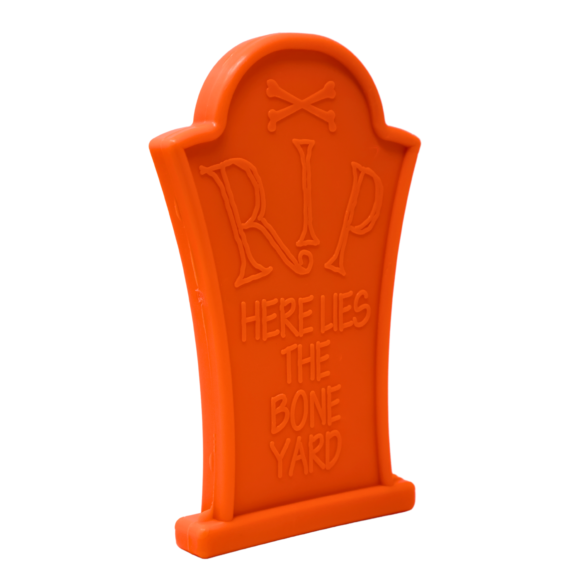 Orange dog chew toy shaped like a tombstone with "RIP Here Lies The Bone Yard" embossed on the front