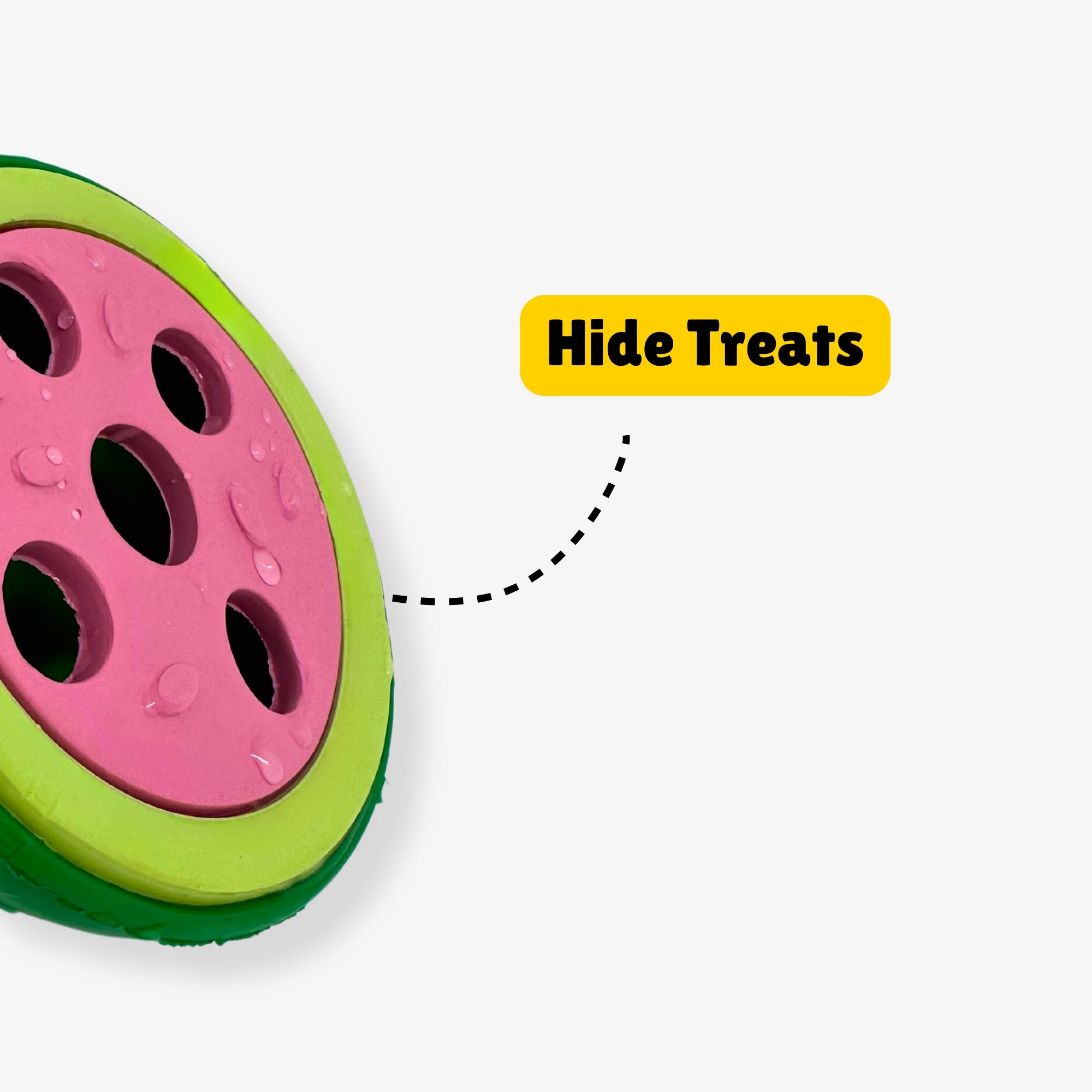 Watermelon-shaped dog toy with treat holes, labeled “Hide Treats” with a dotted arrow