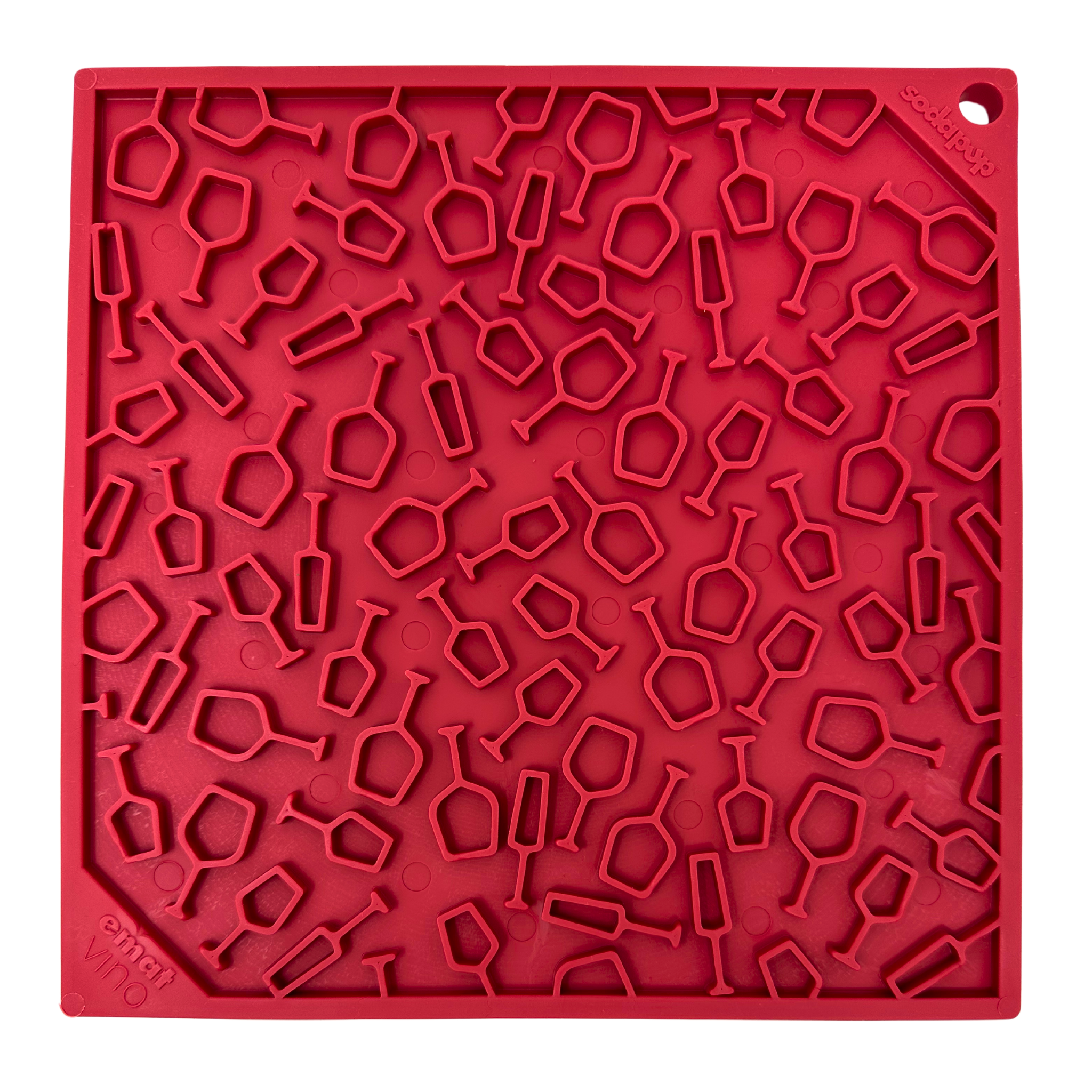 Close-up of a bright red dog lick mat with a unique pattern of glass shapes